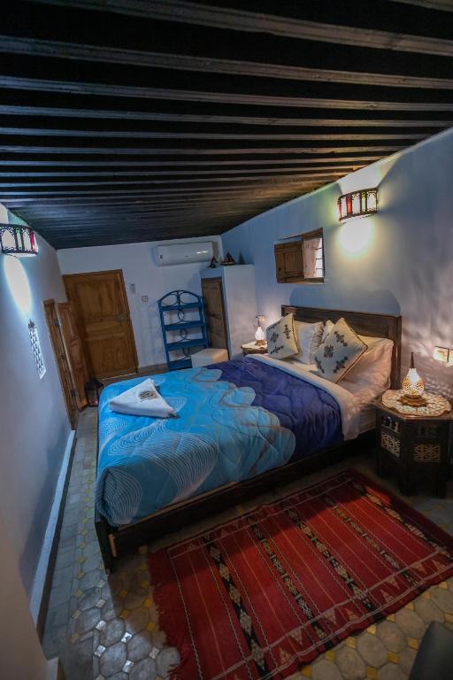 Postel nebo postele na pokoji v ubytování Riad Dar Hidaya Fes