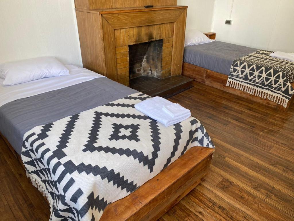 Postel nebo postele na pokoji v ubytování Hostal Ochen