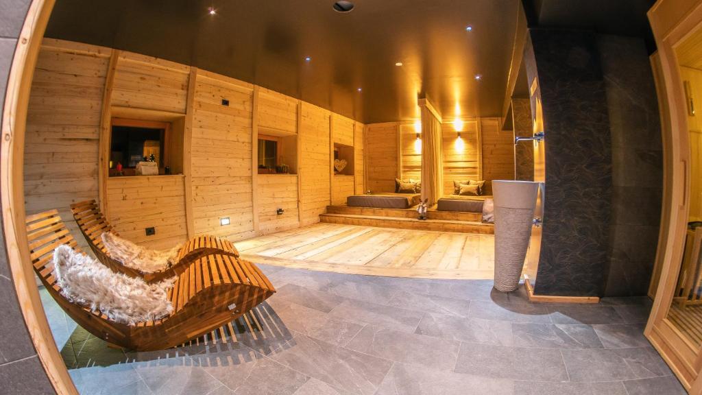 a large room with a hammock in the middle of it at ALPS LOVER in Campodenno