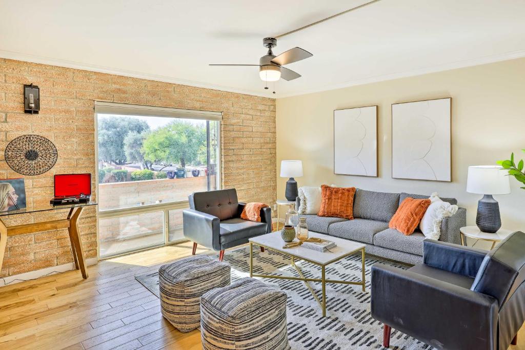 a living room with a couch and a table at Stunning Old Town Condo Pool and Sunset Views! in Scottsdale