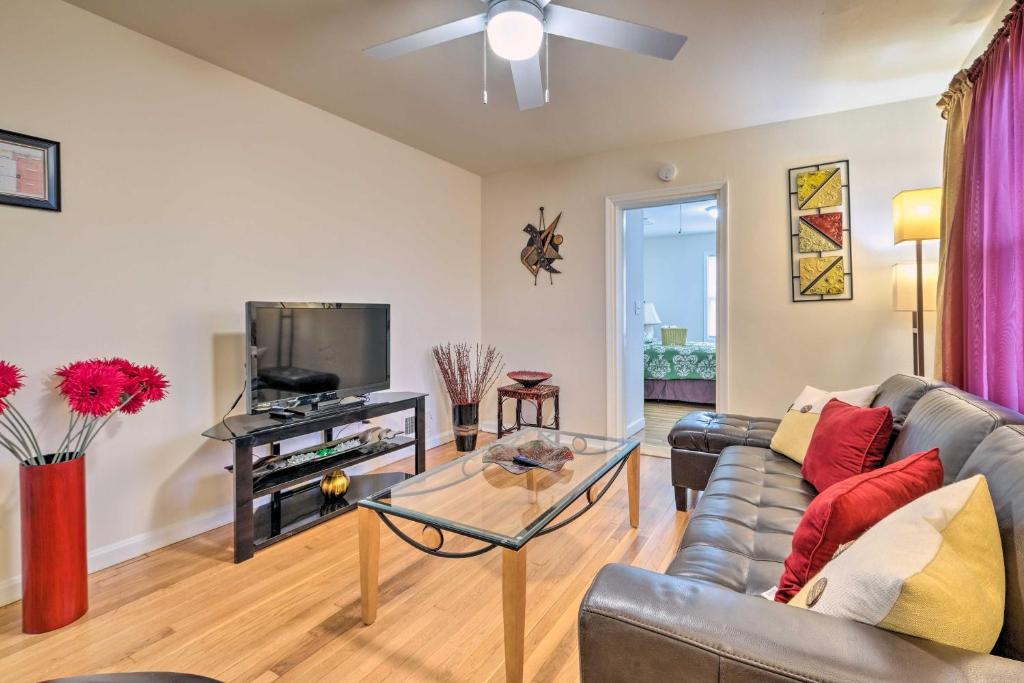 a living room with a couch and a table at Pet-Friendly Home Less Than 6 Mi to National Mall! in Hillcrest Heights