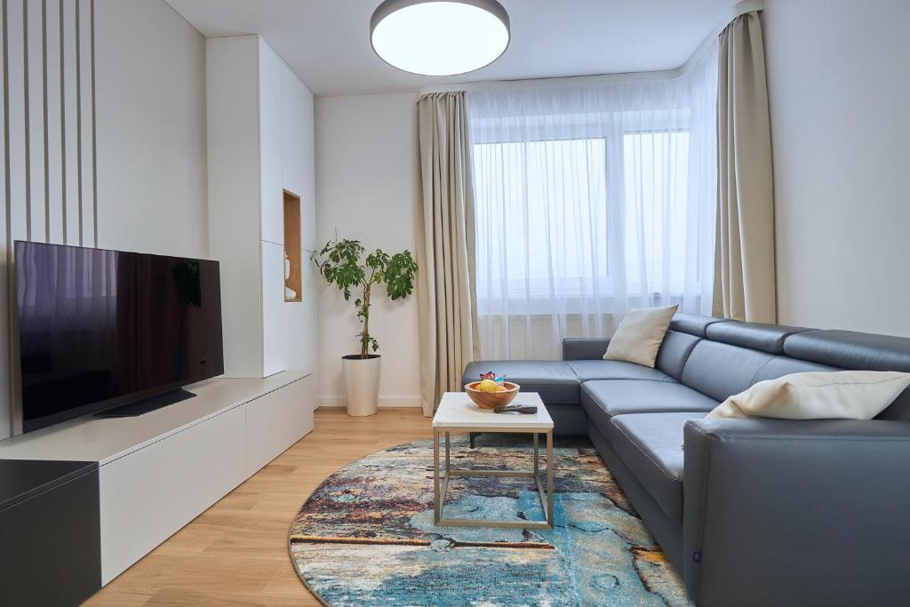 TV a/nebo společenská místnost v ubytování The Gatsby Apartment