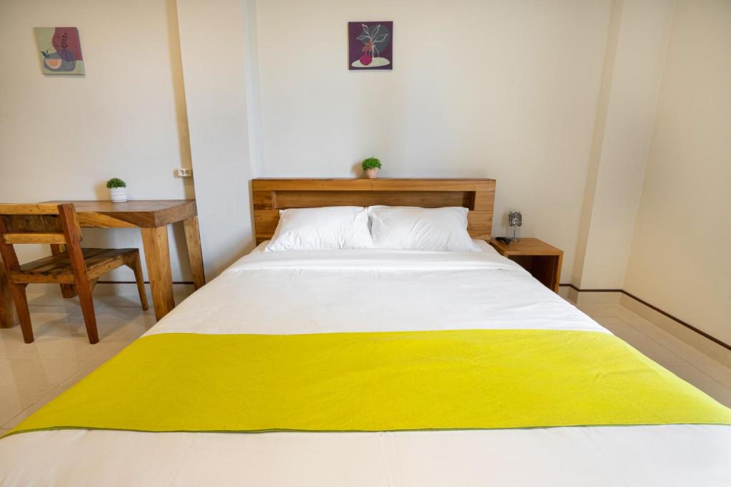 Postel nebo postele na pokoji v ubytování K Hostel Seminyak