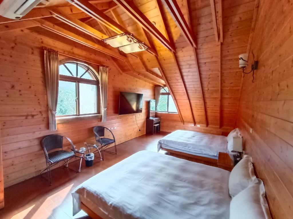 Postel nebo postele na pokoji v ubytování Rong Yuan Gu Homestay