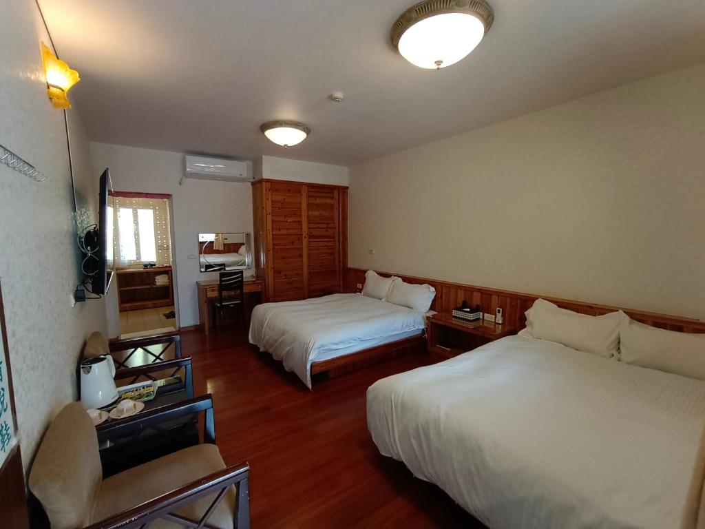 Postel nebo postele na pokoji v ubytování Rong Yuan Gu Homestay