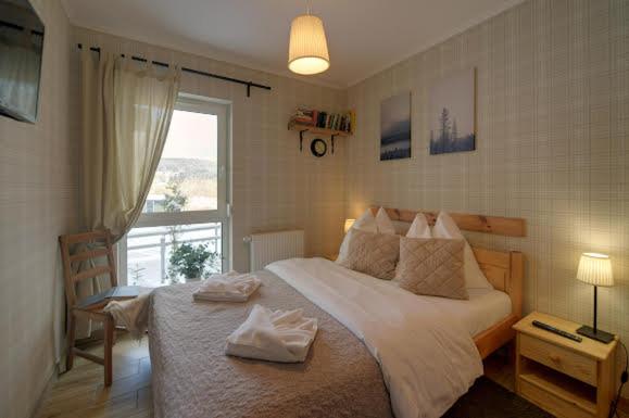 Posteľ alebo postele v izbe v ubytovaní Trevilles apartamenty - Pod Lasem
