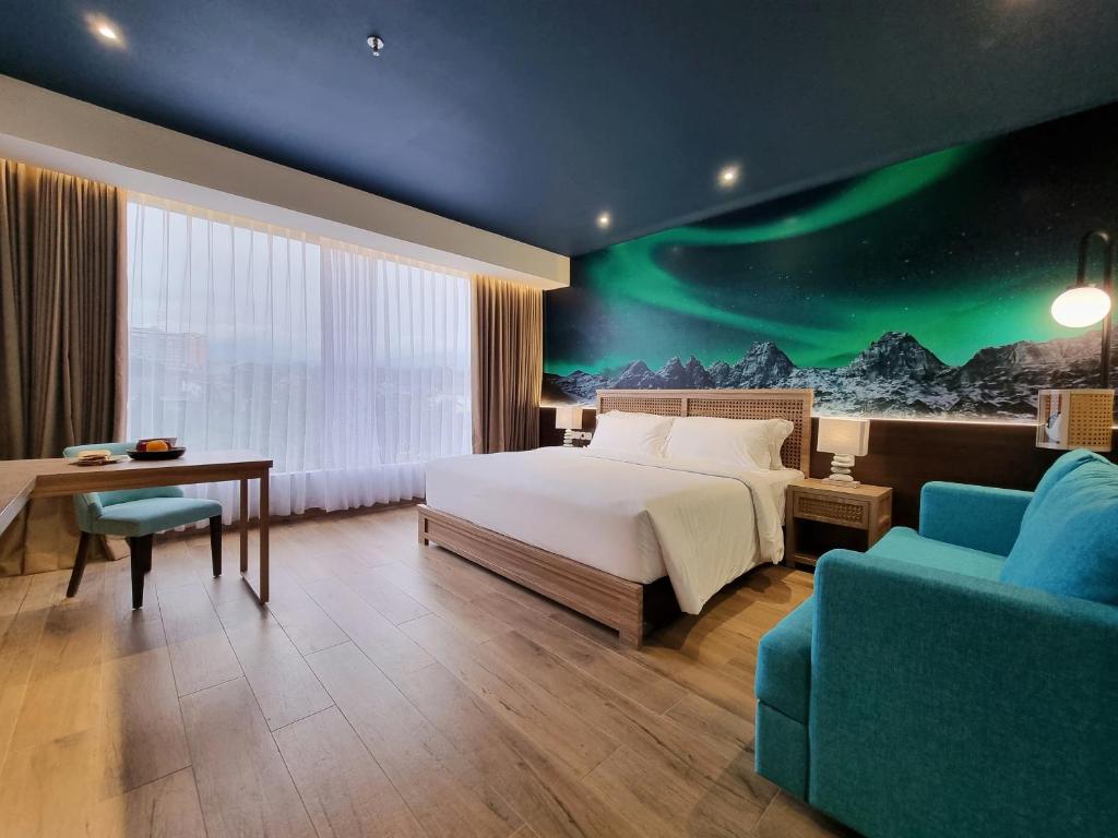 Postel nebo postele na pokoji v ubytování Hemangini Hotel Bandung