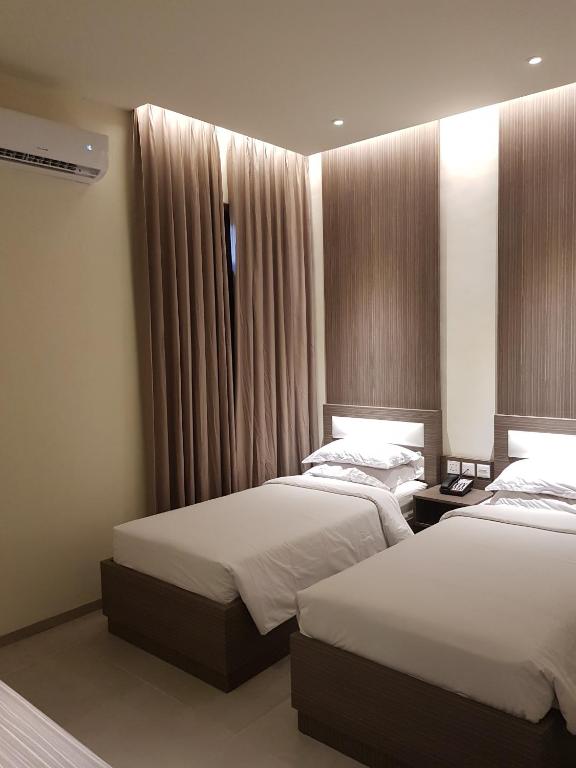 Postel nebo postele na pokoji v ubytování Sanghyang Indah Spa Resort