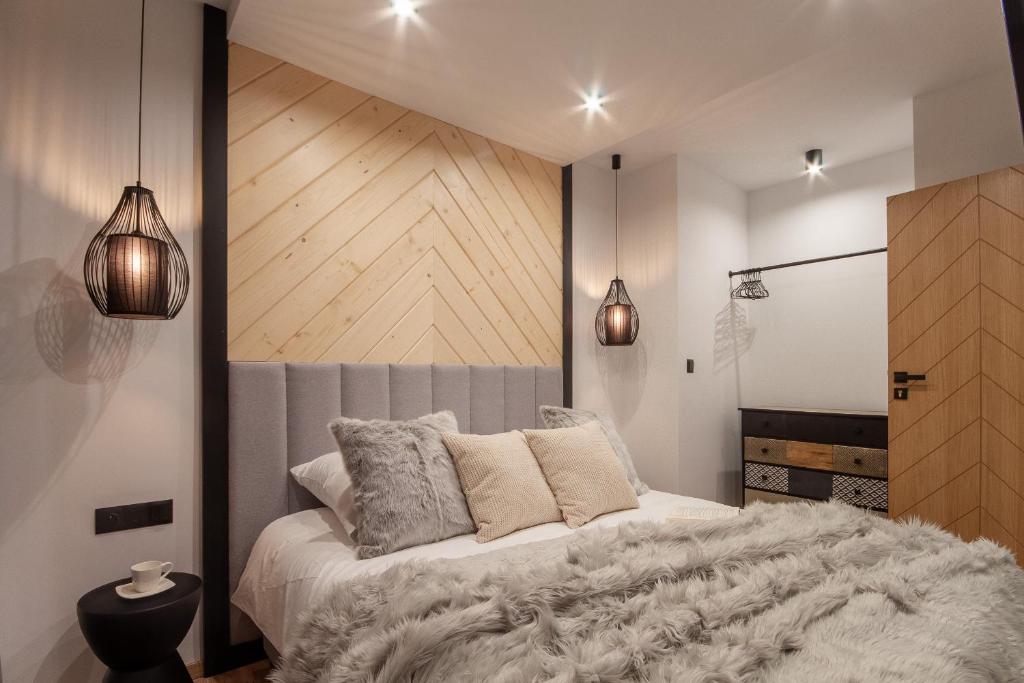 Posteľ alebo postele v izbe v ubytovaní Apartamenty u Zajączków