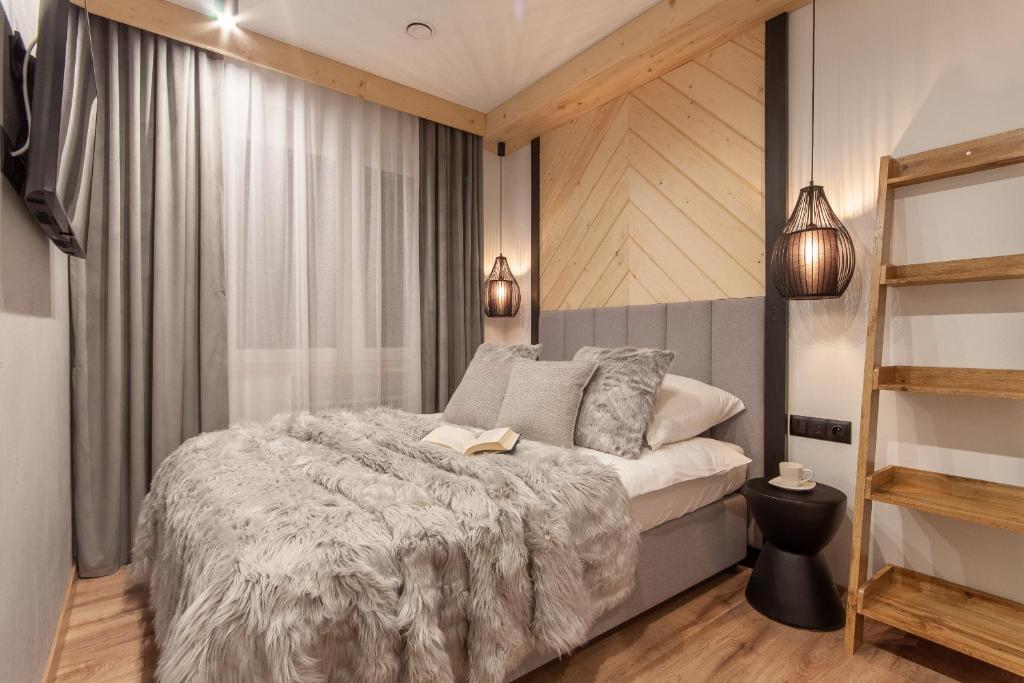 Posteľ alebo postele v izbe v ubytovaní Apartamenty u Zajączków