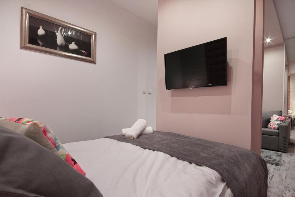 Posteľ alebo postele v izbe v ubytovaní Apartamenty u Zajączków