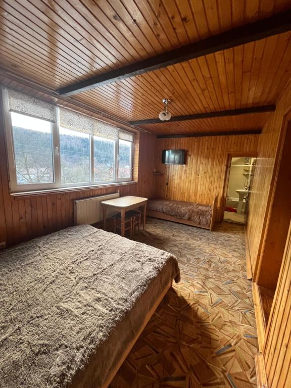 Postel nebo postele na pokoji v ubytování Sadyba Три Серця ЧАН БАНЯ ЯРЕМЧЕ