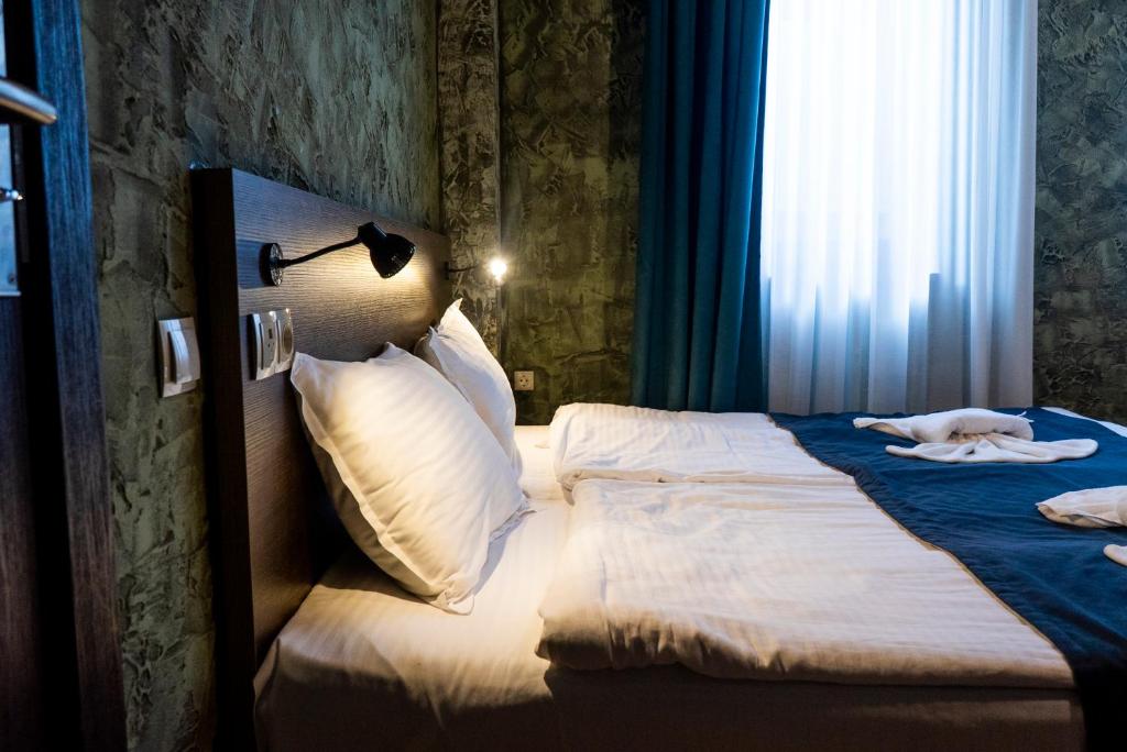 Postel nebo postele na pokoji v ubytování Old Tbilisi Terrace