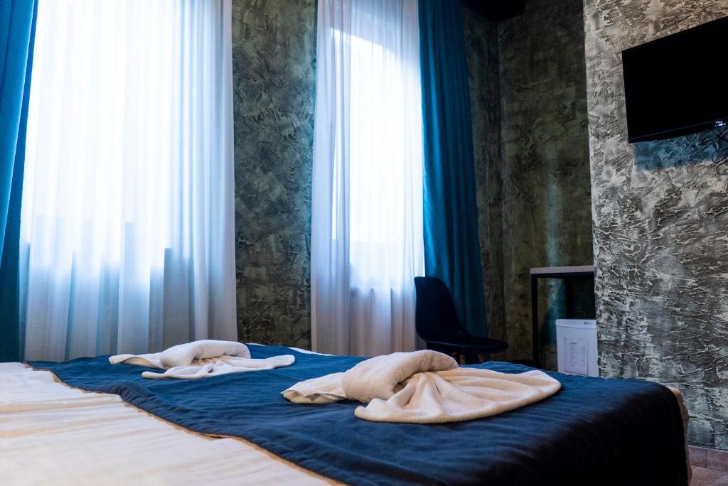 Postel nebo postele na pokoji v ubytování Old Tbilisi Terrace