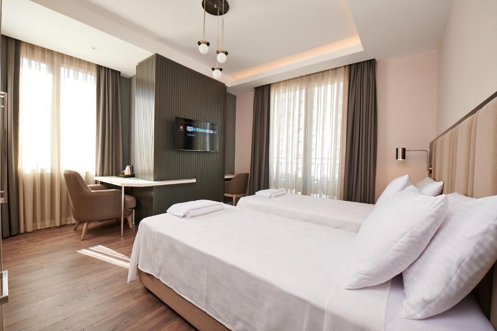 Postel nebo postele na pokoji v ubytování Livinton İstanbul Ataşehir