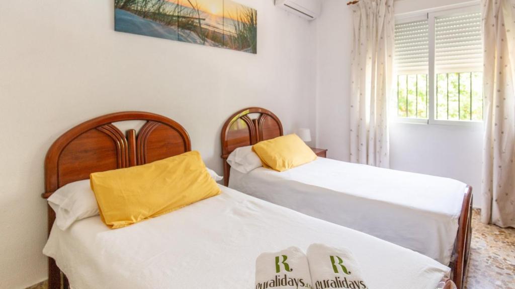 A bed or beds in a room at Chalet Brillante Córdoba by Ruralidays