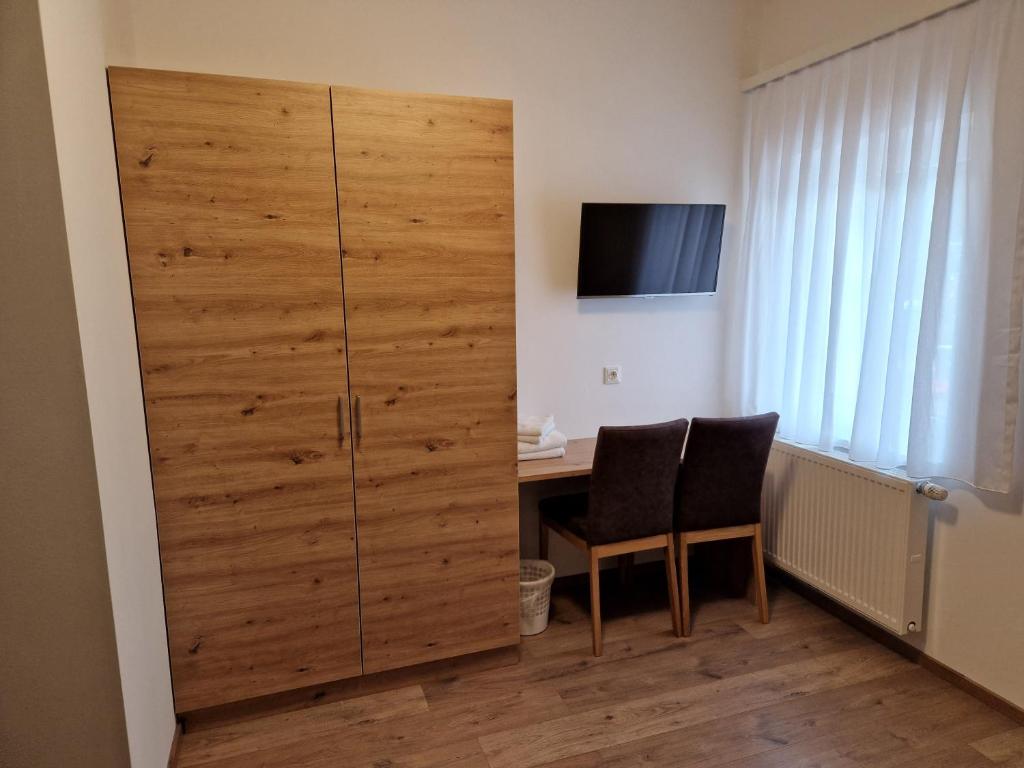 En tv och/eller ett underh&aring;llningssystem p&aring; Appartement Sami