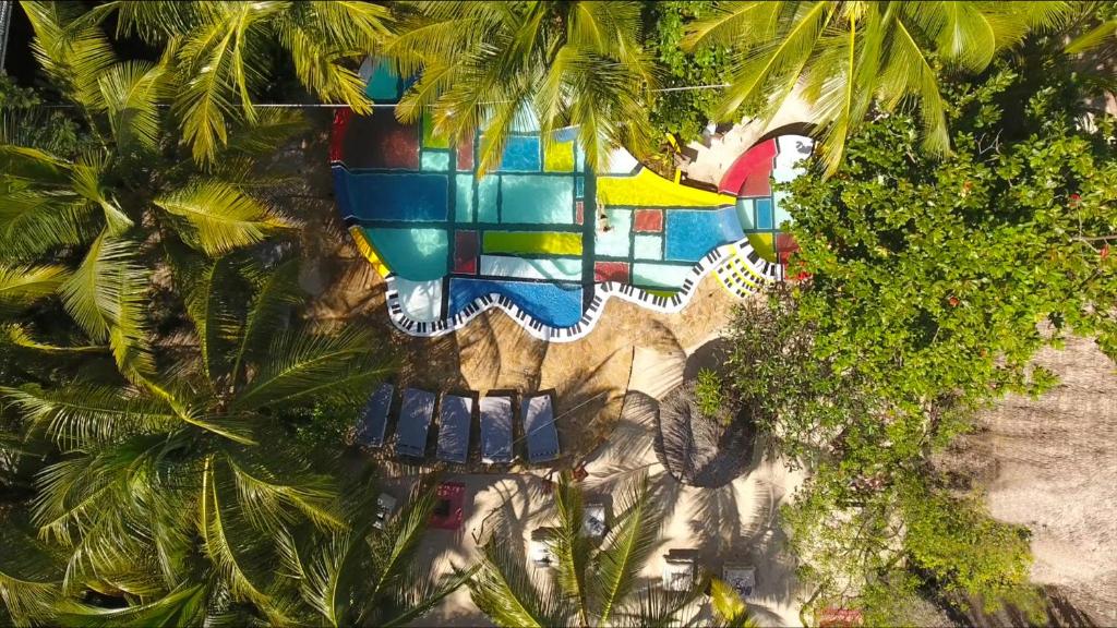 an overhead view of a resort with palm trees at Paje by Night in Paje