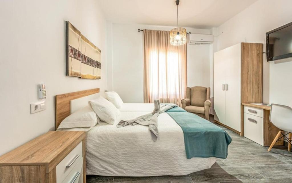 Lova arba lovos apgyvendinimo įstaigoje Apartamento en Urbanización Residencial - Roble, 5