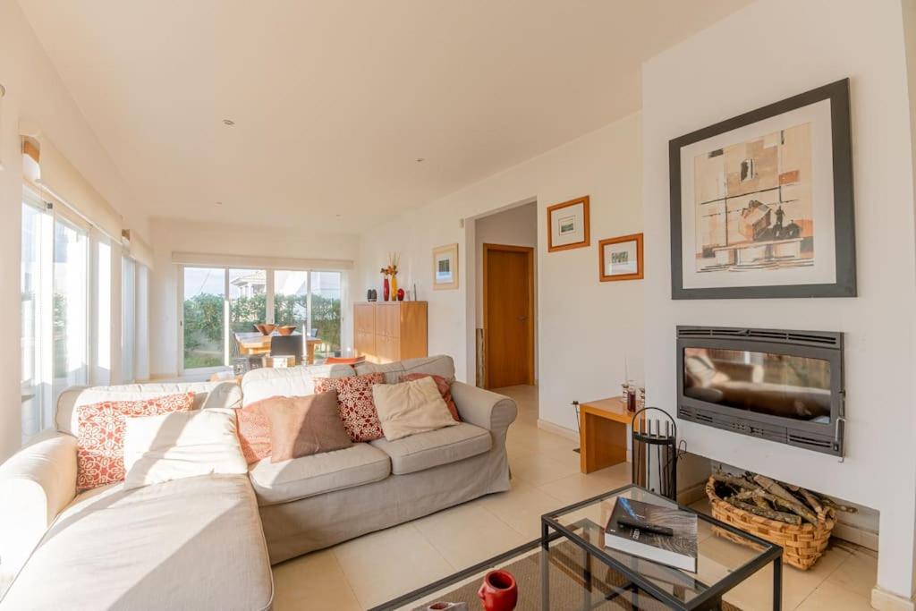 a living room with a couch and a tv at Moradia Villa Brava - Algarve in Alvor