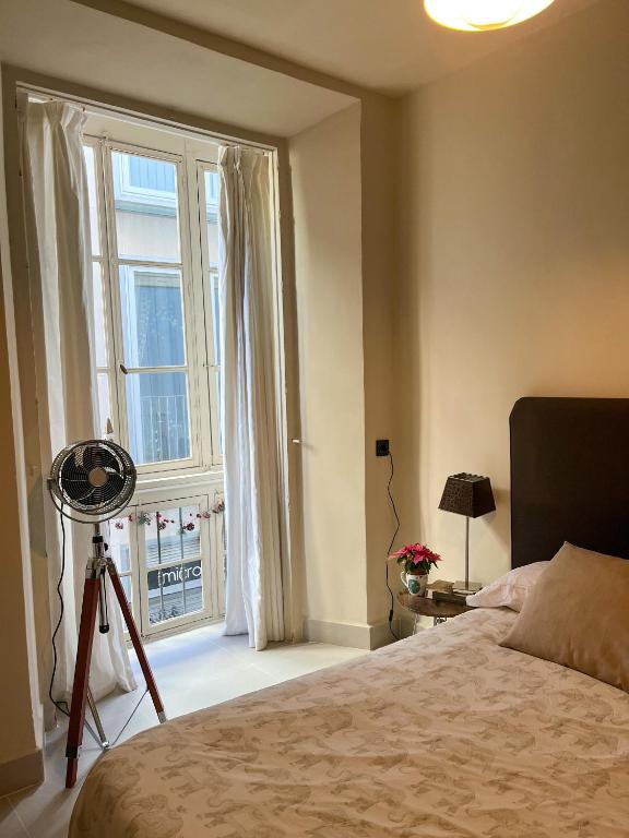 Posteľ alebo postele v izbe v ubytovaní Apartamento Málaga Centro Tritón