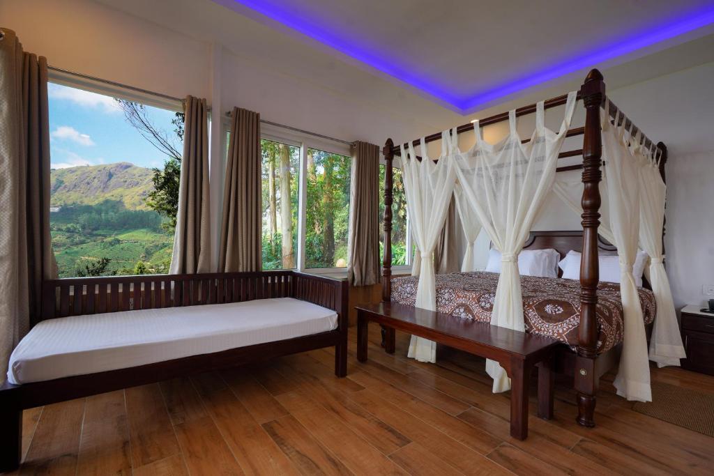 Postel nebo postele na pokoji v ubytování Tea Valley Resort, Munnar