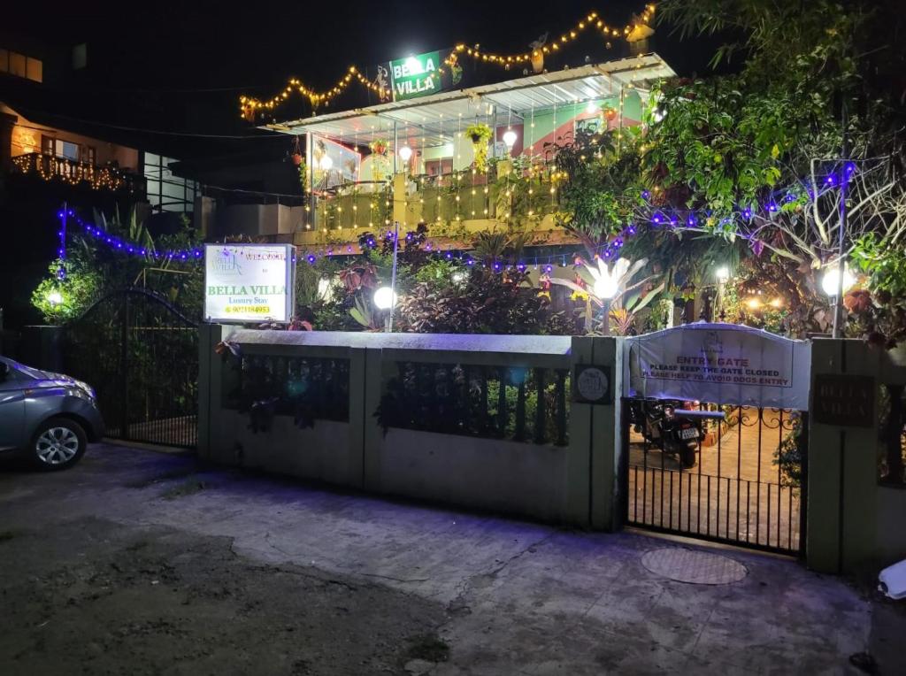 a house decorated with christmas lights at night at Bella Villa Luxury Stay in Panaji