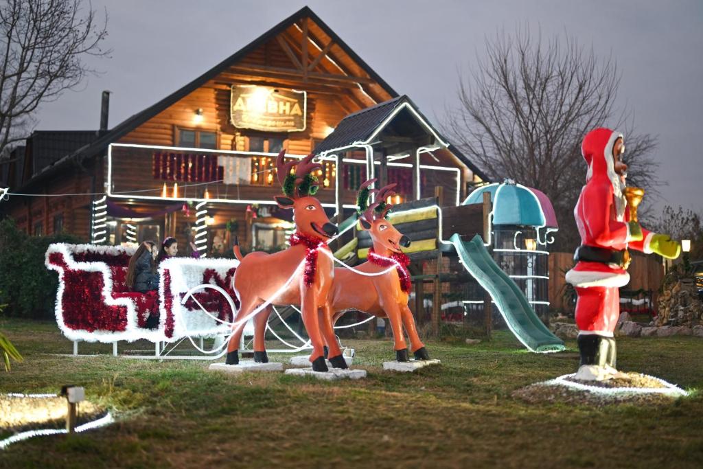 a christmas display of two horses on a playground at Lolini bungalovi in Novi Sad