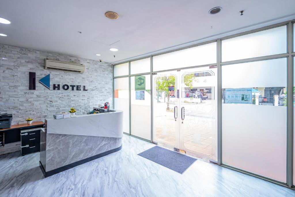 a lobby of a hotel with a large glass door at K Hotel 12 in Singapore