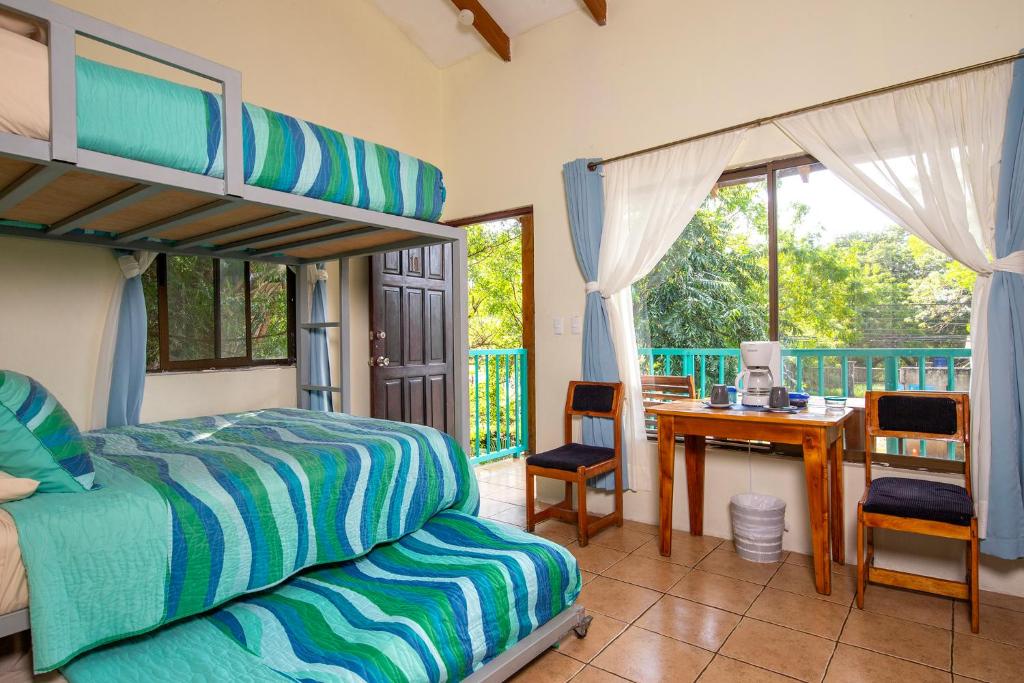 Postel nebo postele na pokoji v ubytování Hotel Diversion Tropical
