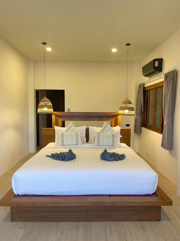 Ein Bett oder Betten in einem Zimmer der Unterkunft High Life Villas