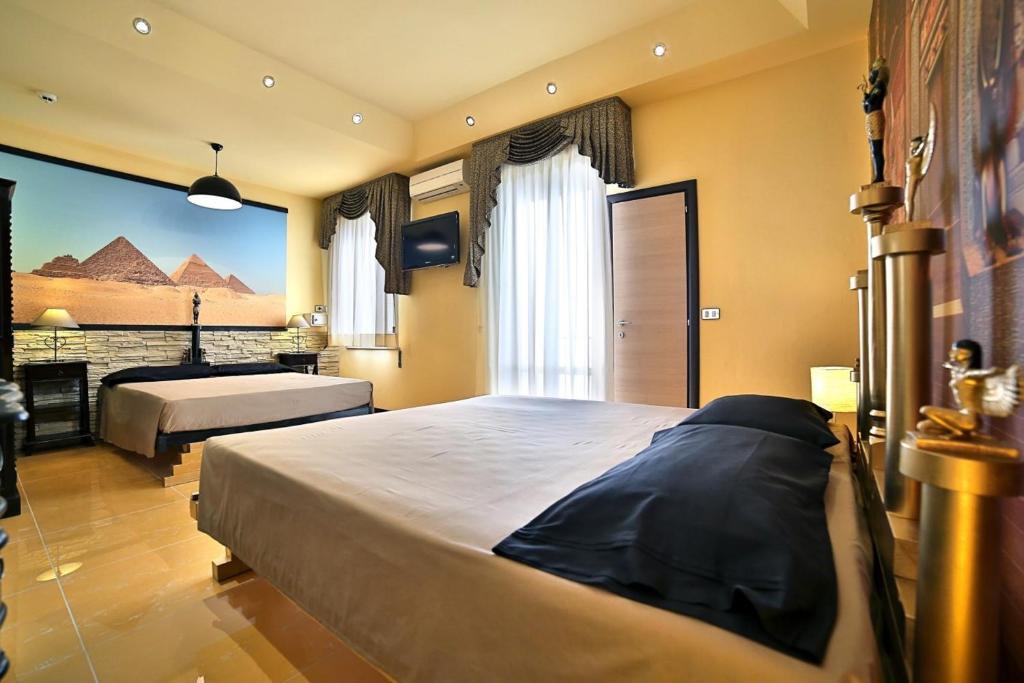 Postel nebo postele na pokoji v ubytování Hotel Fabrizio
