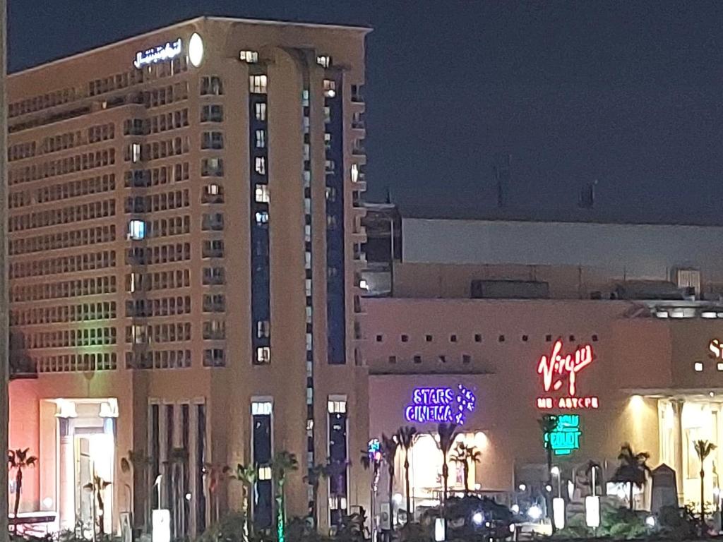 a view of the mgm hotel and casino at night at Ramo City Stars Hotel in Cairo