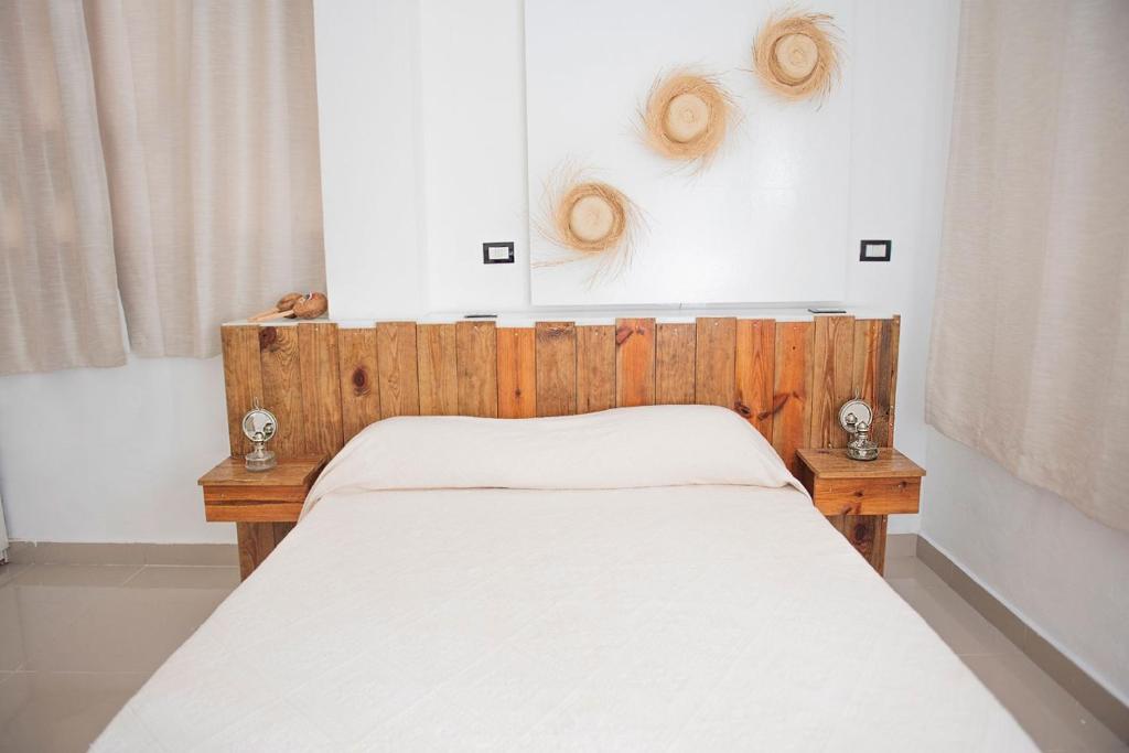 Postel nebo postele na pokoji v ubytování Hostal Mamà Mambò - Zona Colonial