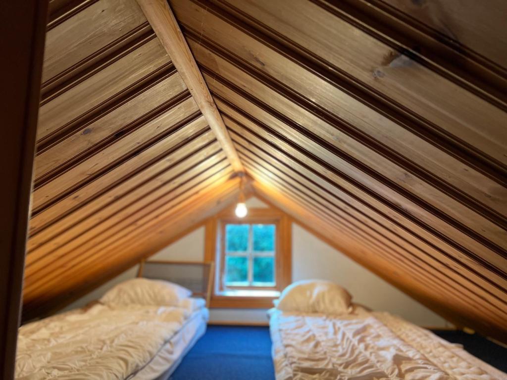 Postel nebo postele na pokoji v ubytování Gammelgården Guesthouse