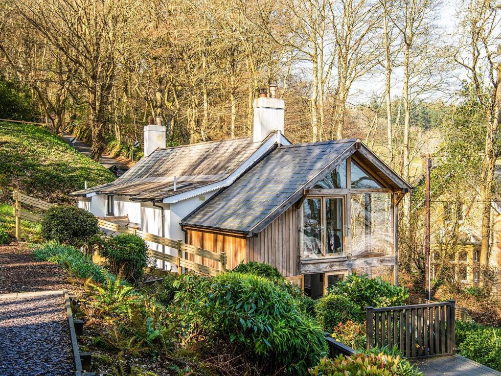 a small house with a tin roof on a hill at Peakaboo in Sidmouth