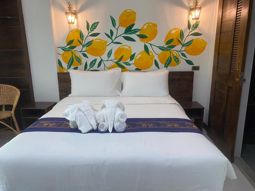 Postel nebo postele na pokoji v ubytování Lemon Guesthouse