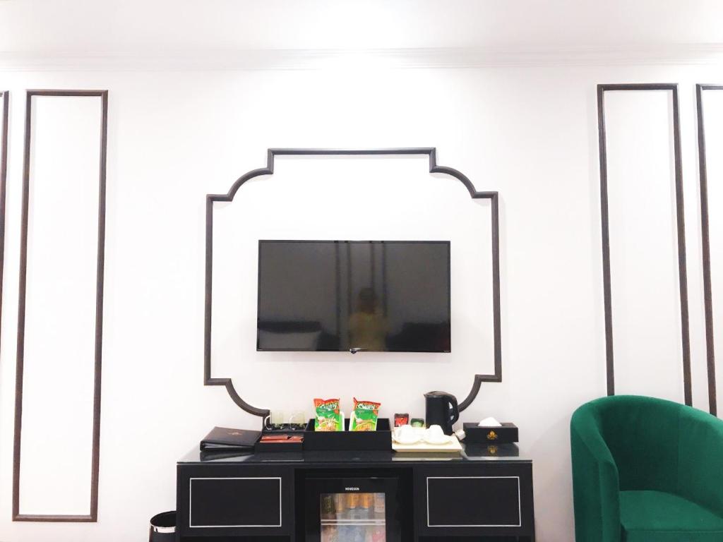 TV a/nebo společenská místnost v ubytování Rosy Hotel
