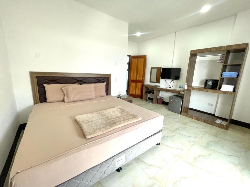 Postel nebo postele na pokoji v ubytování MGH Alona Resort