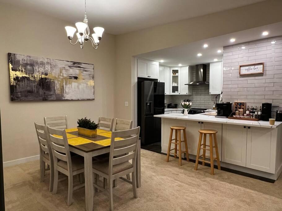 a kitchen and dining room with a table and chairs at Luxury Condo-Downtown Bellevue in Bellevue