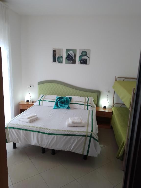 Postel nebo postele na pokoji v ubytování Hotel Riposo