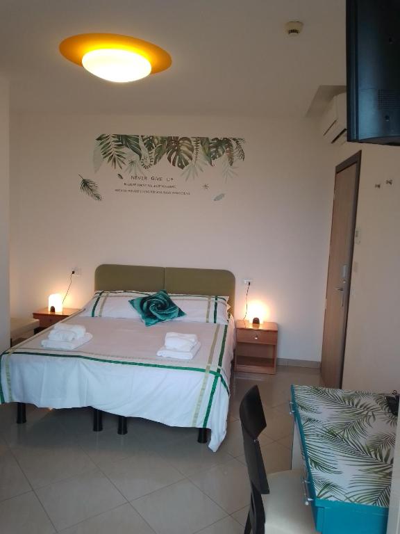 Postel nebo postele na pokoji v ubytování Hotel Riposo