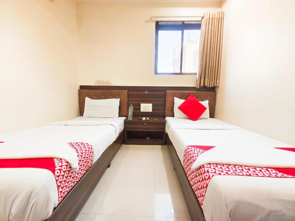 Postel nebo postele na pokoji v ubytování Hotel Avion Park - Near Mumbai International Airport