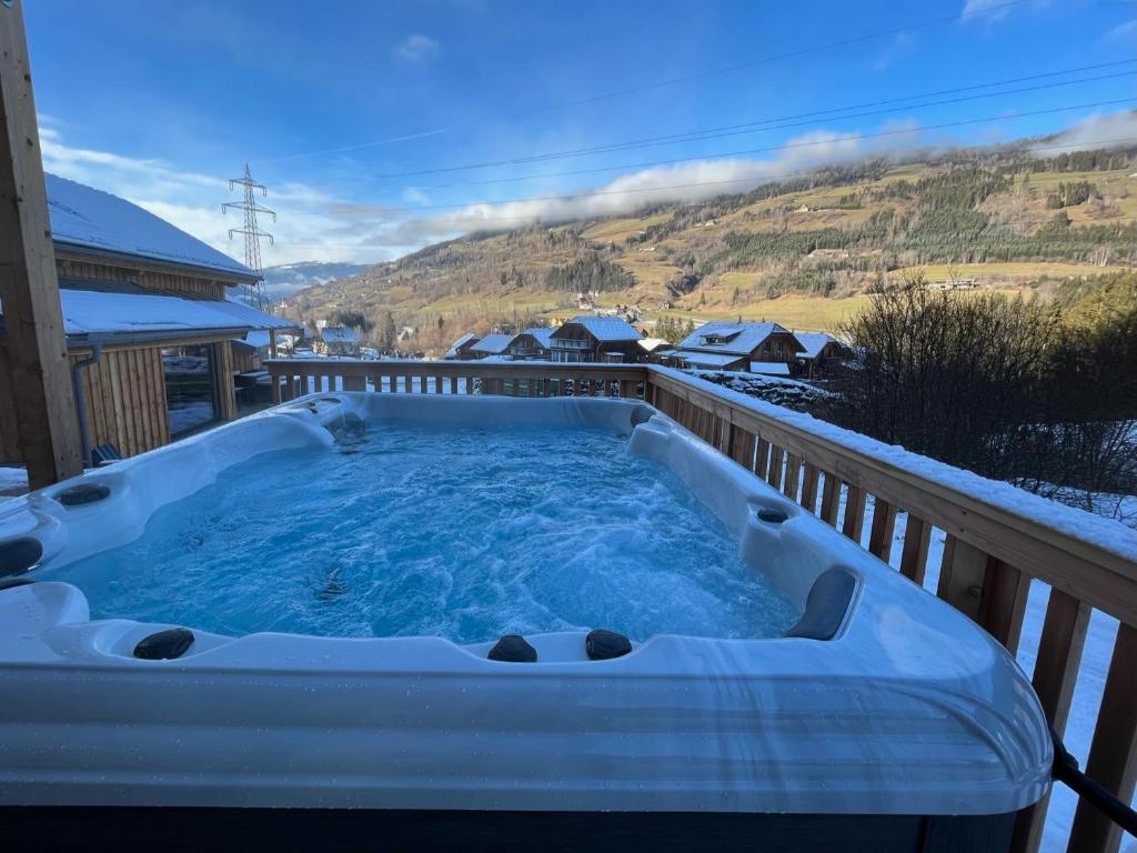 a jacuzzi tub on the deck of a house at Chalet Bavaria in Sankt Lorenzen ob Murau
