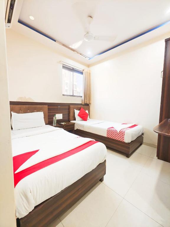 Postel nebo postele na pokoji v ubytování Hotel Avion Park - Near Mumbai International Airport