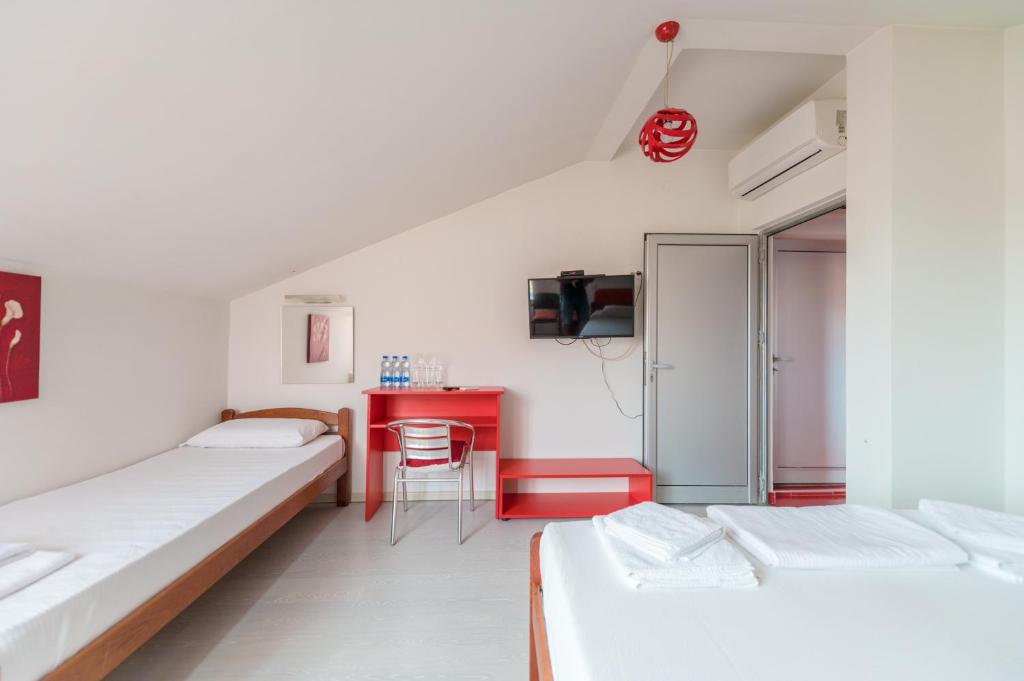 Postel nebo postele na pokoji v ubytování Hotel Villa Sarto