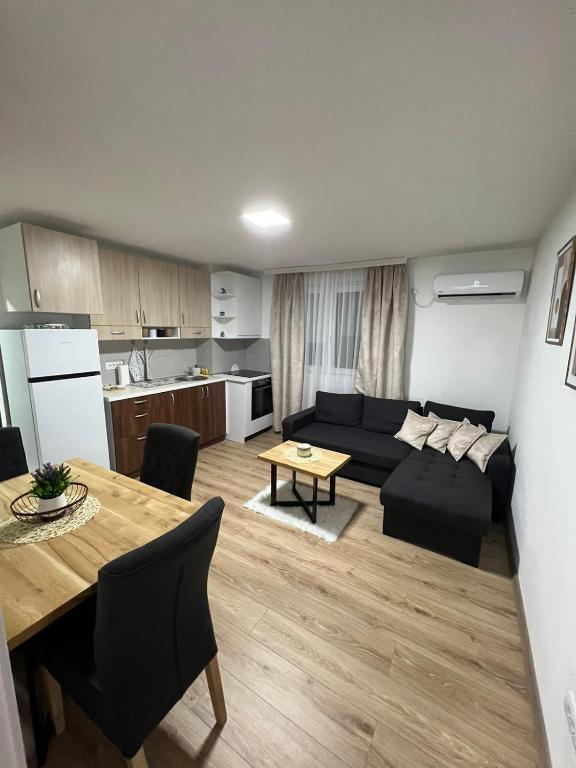 a living room with a couch and a table at Apartman Antonovic in Valjevo