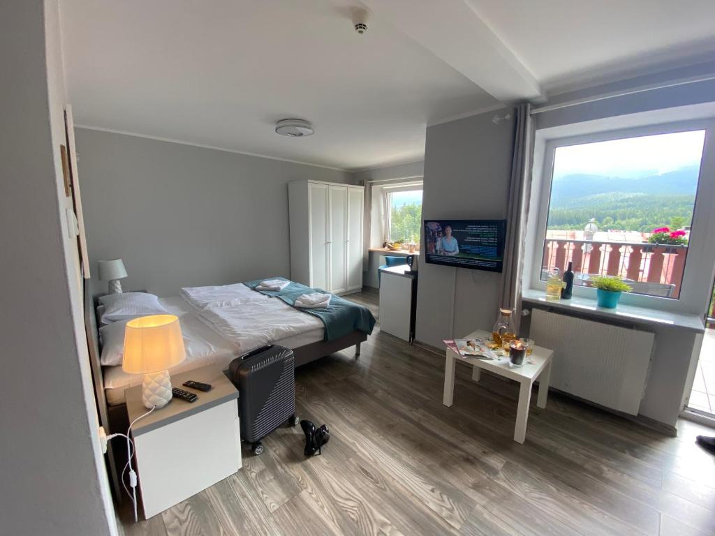 Posteľ alebo postele v izbe v ubytovaní Willa Sonata - Apartamenty & Balia - Szklarska Poręba