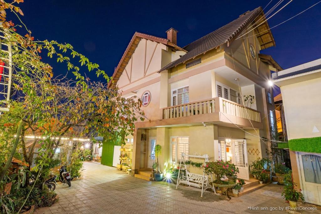 a house with a courtyard at night at Lam Vien Garden Villa - Homestay Da Lat in Da Lat