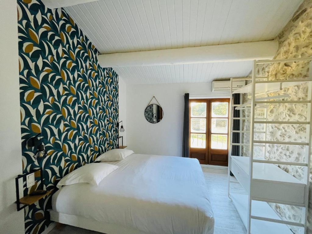 Postel nebo postele na pokoji v ubytování Hôtel La Bastide de Vaison